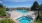 a swimming pool behind a building