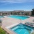 a swimming pool behind a building