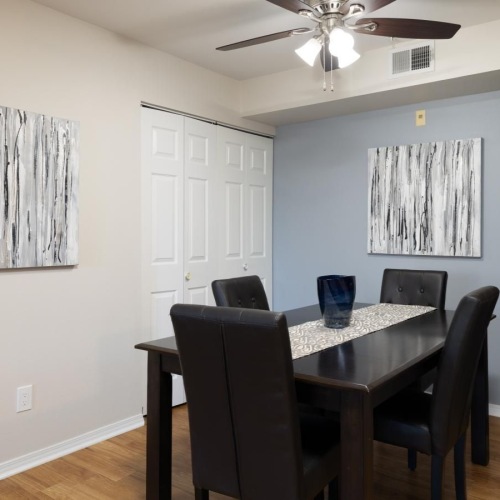 a room with a table and chairs